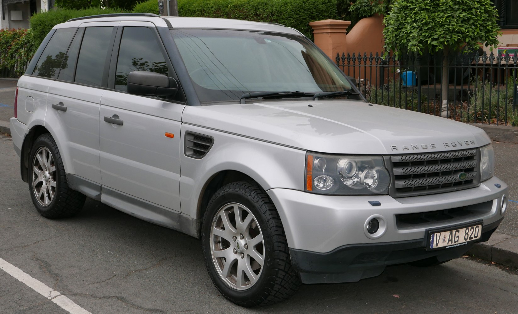 Front-side view of a rugged SUV with distinctive headlights and alloy wheels.