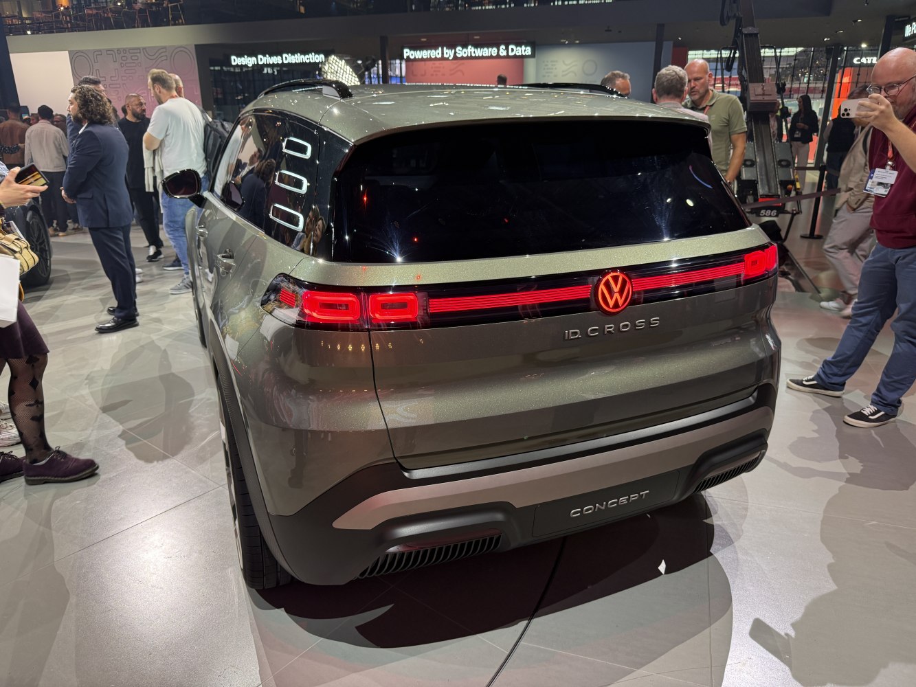 Rear view of electric SUV with distinctive LED tail lights and illuminated emblem