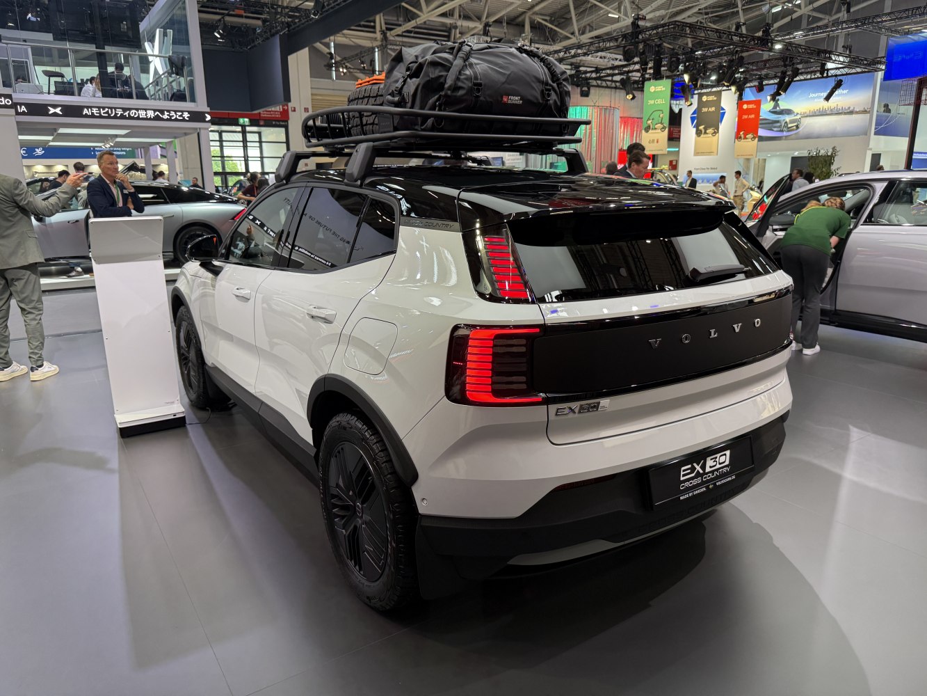 Rear view with LED taillights and loaded roof rack.