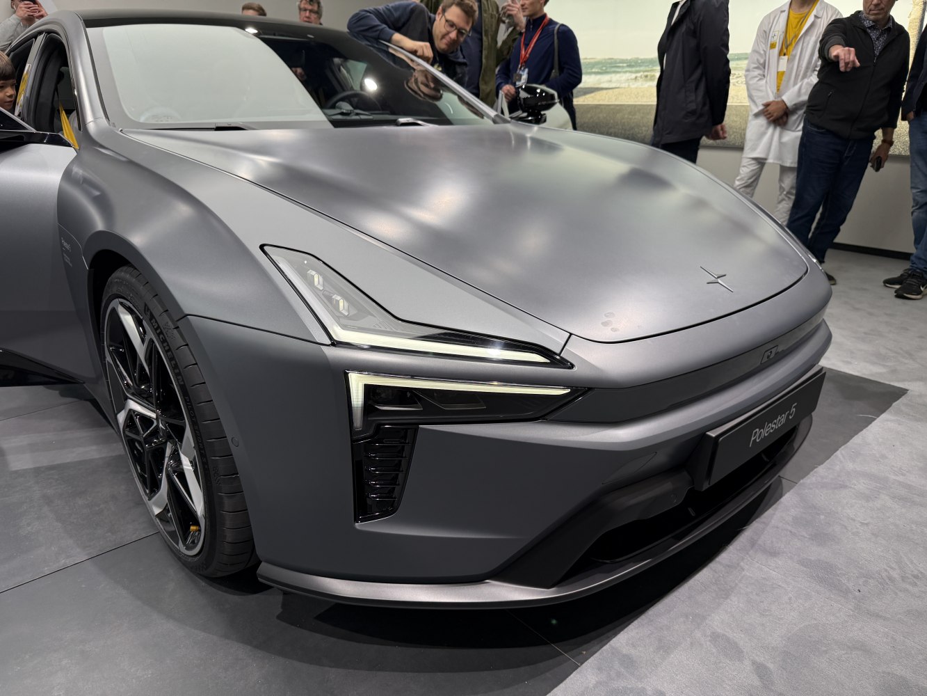 Sleek front with distinctive LED headlights and sporty wheels.