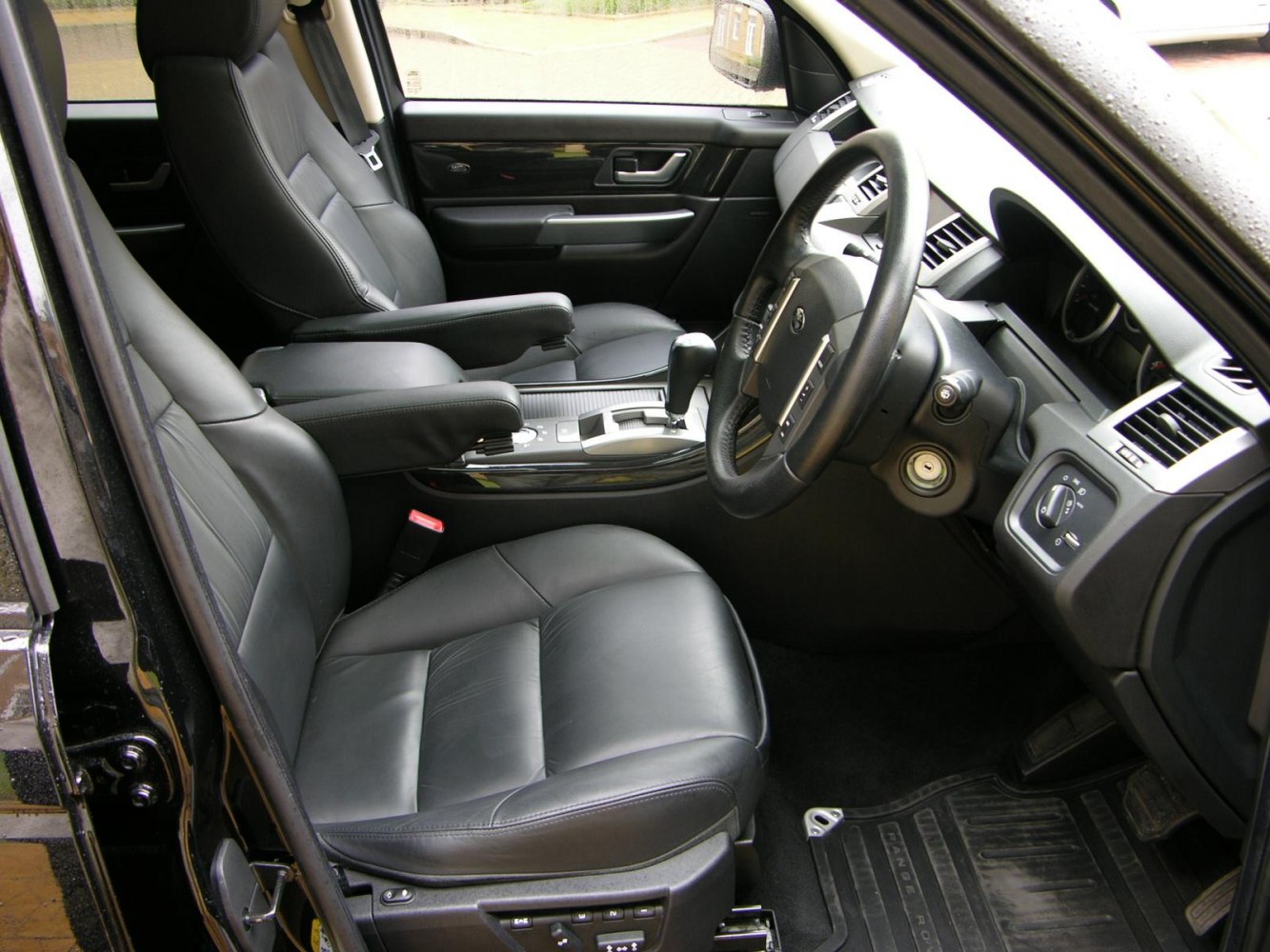 Black leather seats, dashboard, and center console interior