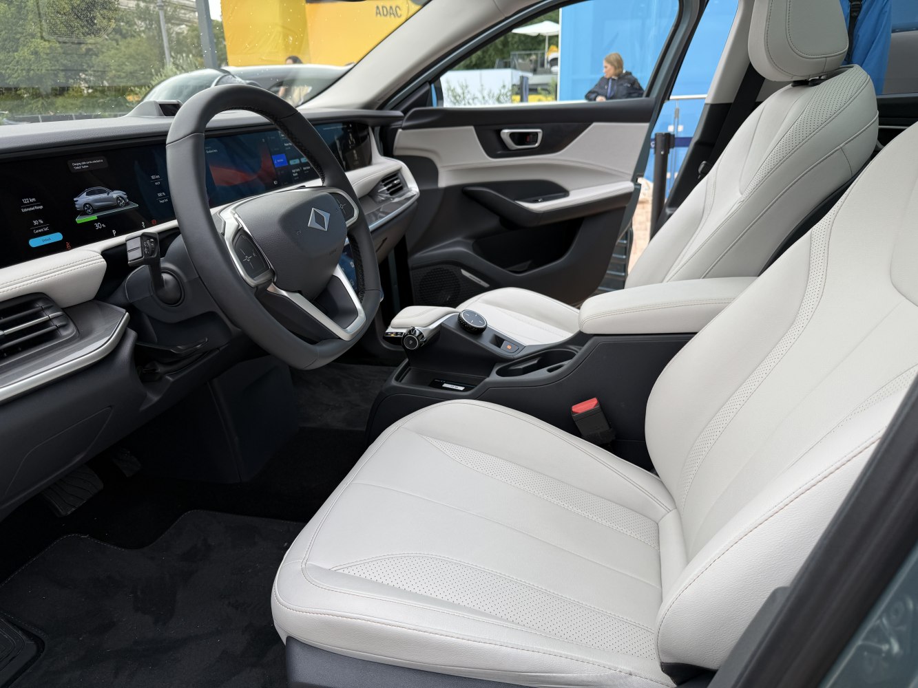 Digital dashboard and white leather front seats