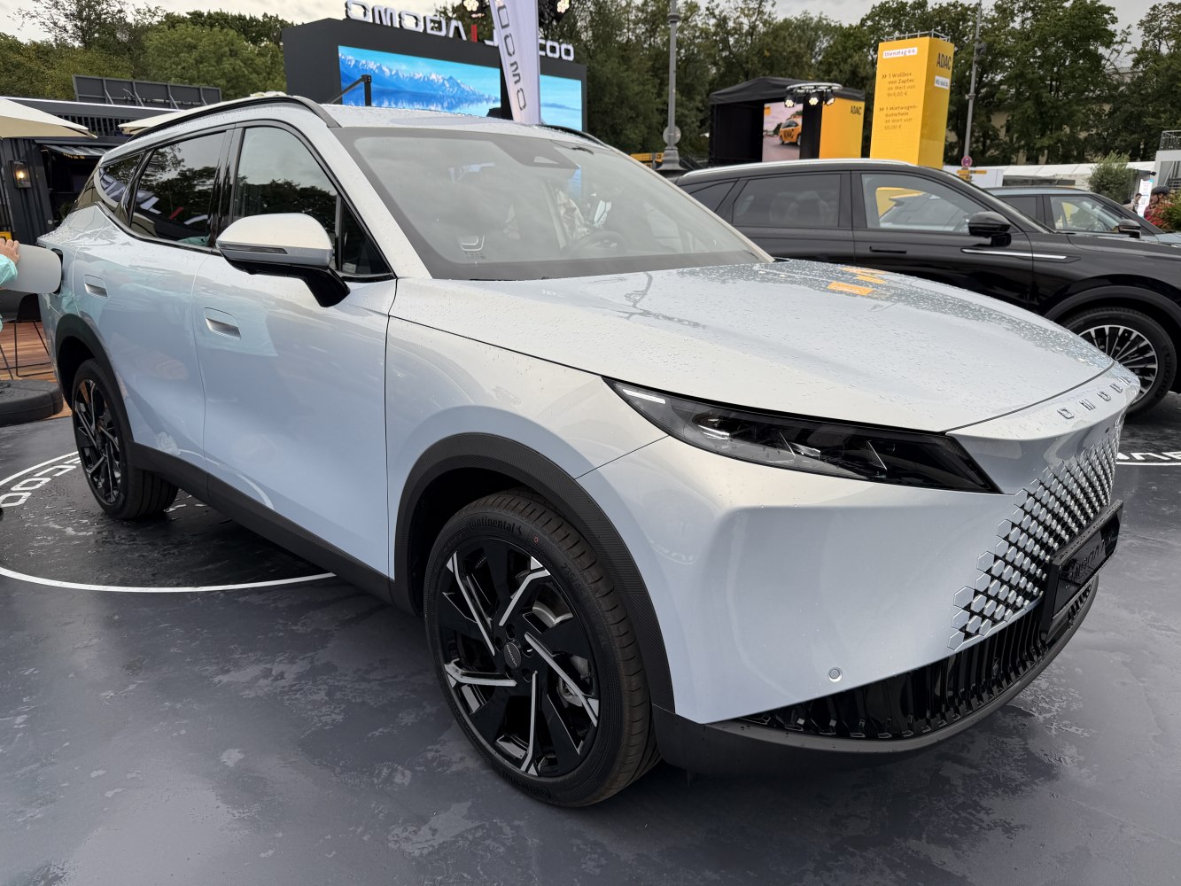 Futuristic front grille with sleek LED headlights and black alloy wheels