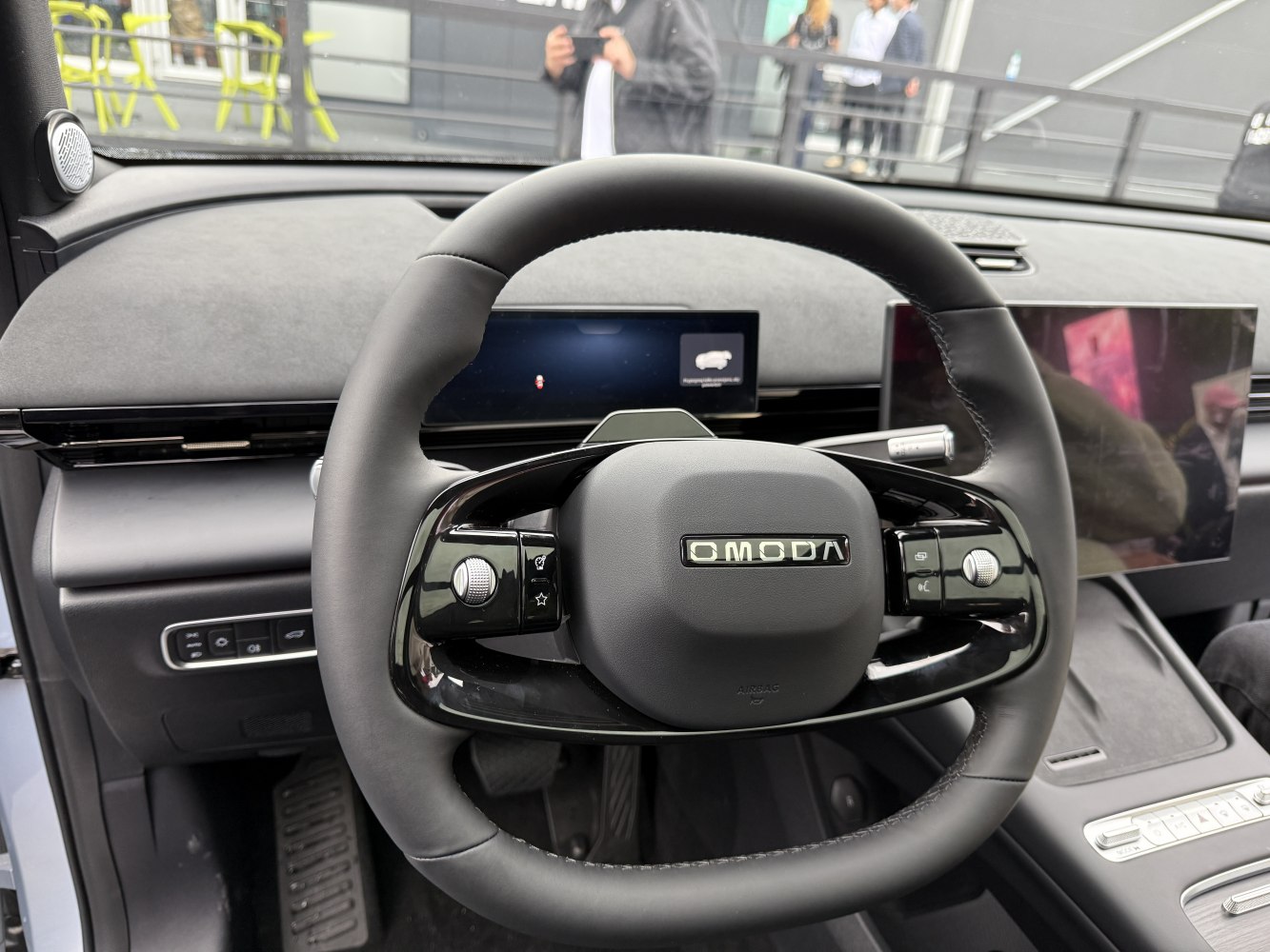Modern steering wheel with dual digital screens and sleek controls