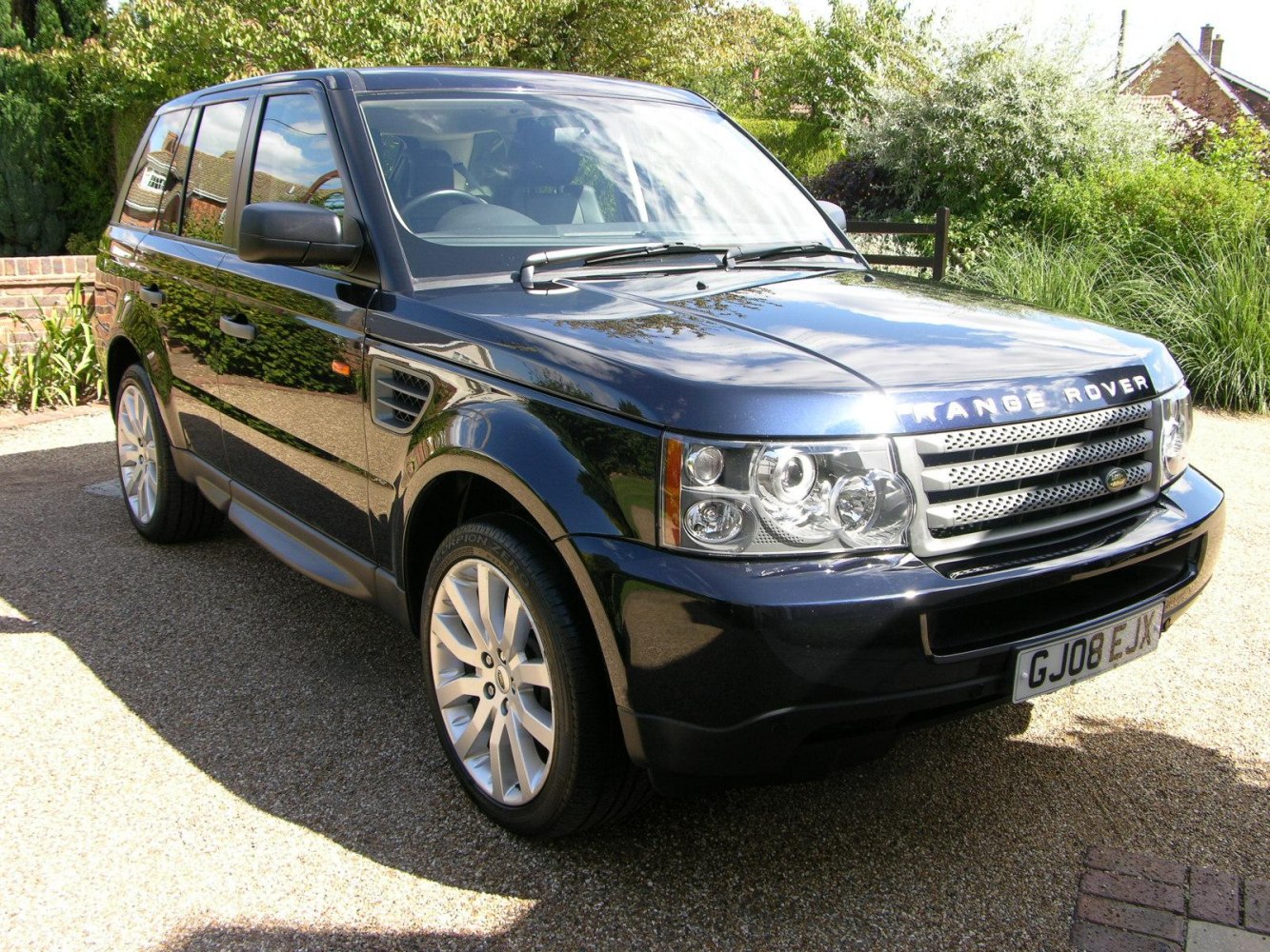 Front and side view of SUV with signature grille and alloy wheels