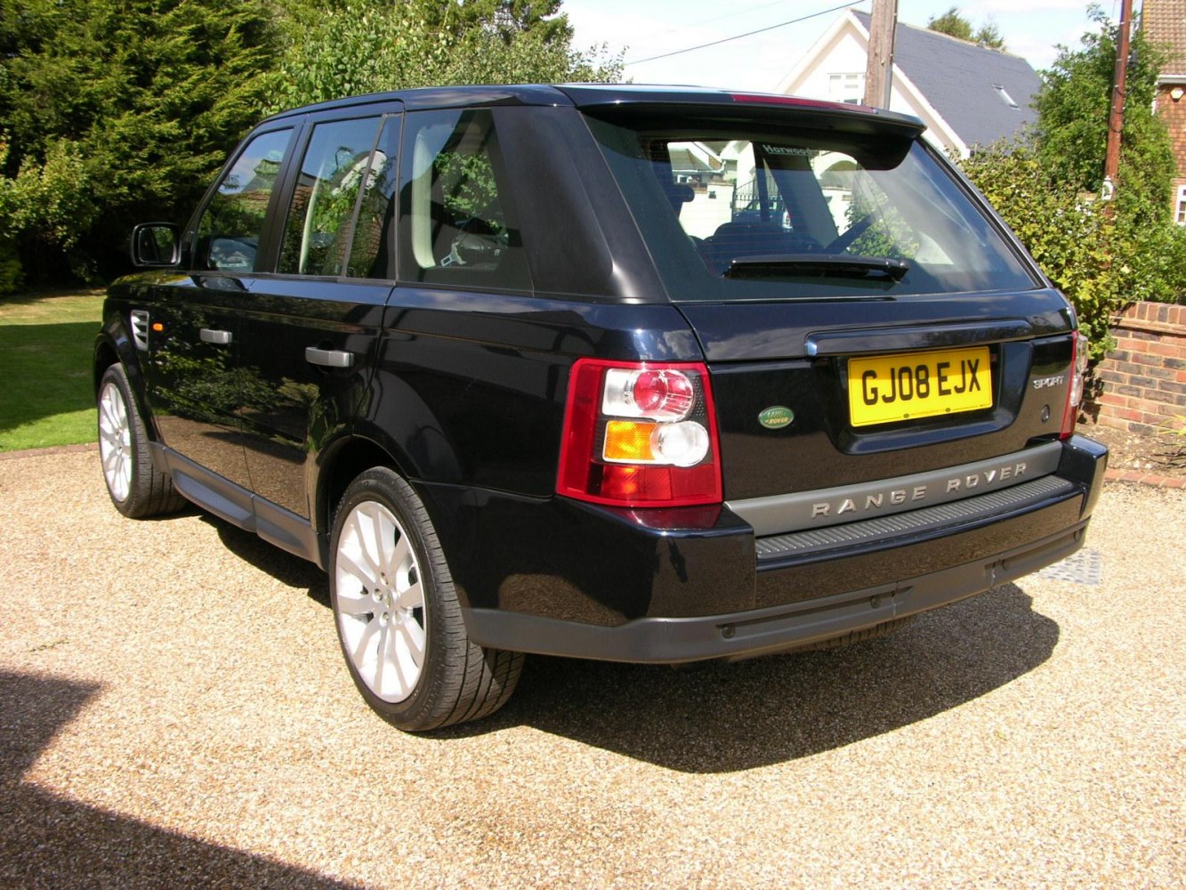 Rear view of a black SUV with distinctive taillights and robust design