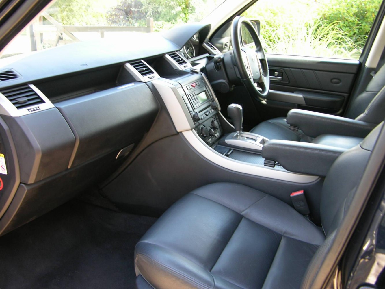 Dashboard, steering wheel, center console, and leather seats interior
