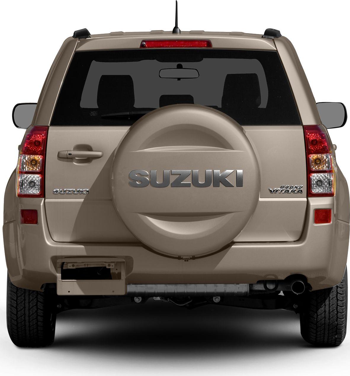 Rear view of SUV with spare tire on tailgate and taillights.