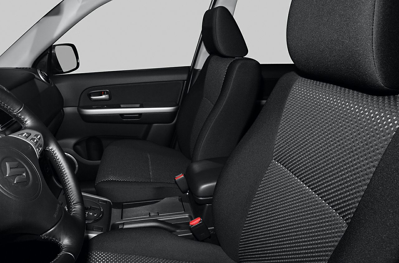 Front seats, door panel, steering wheel, and center console close-up view