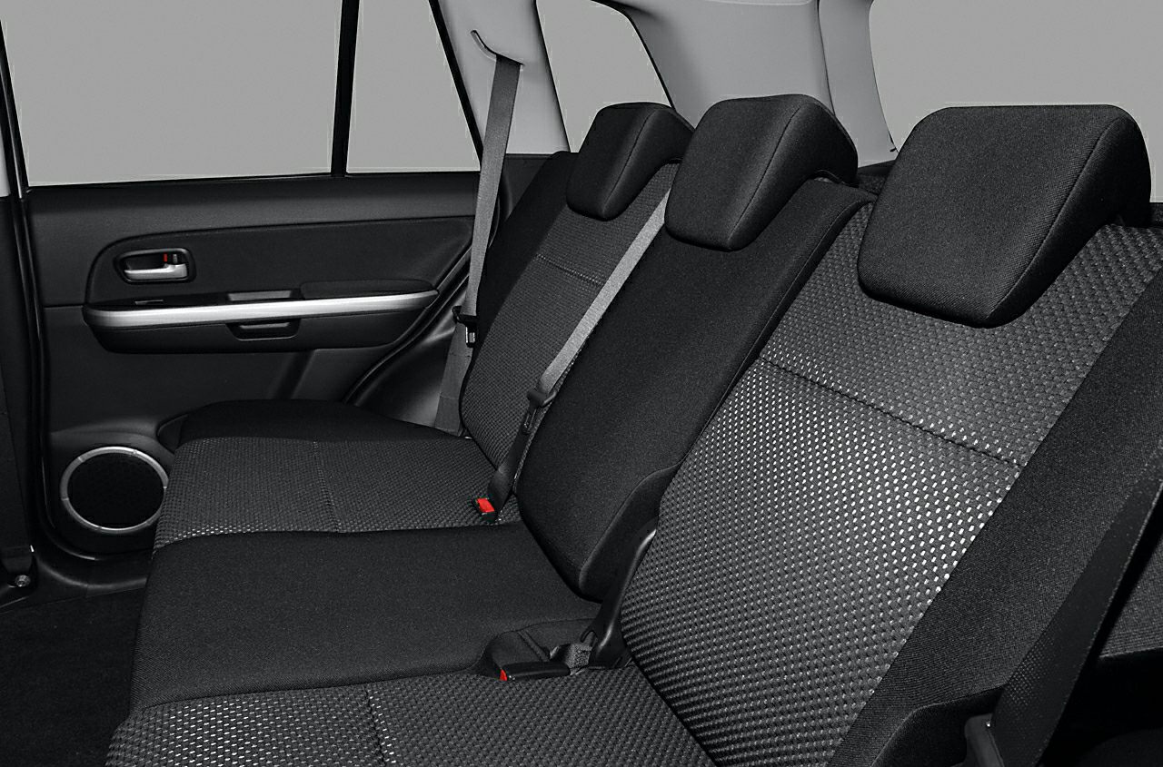 Rear seat interior with fabric upholstery and seat belts