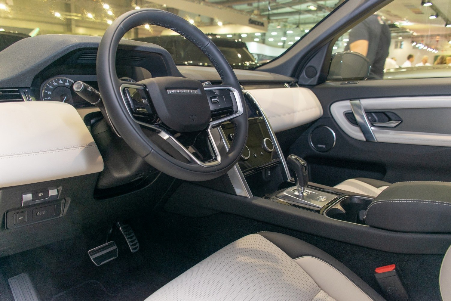 Luxury SUV interior with steering wheel and modern dashboard