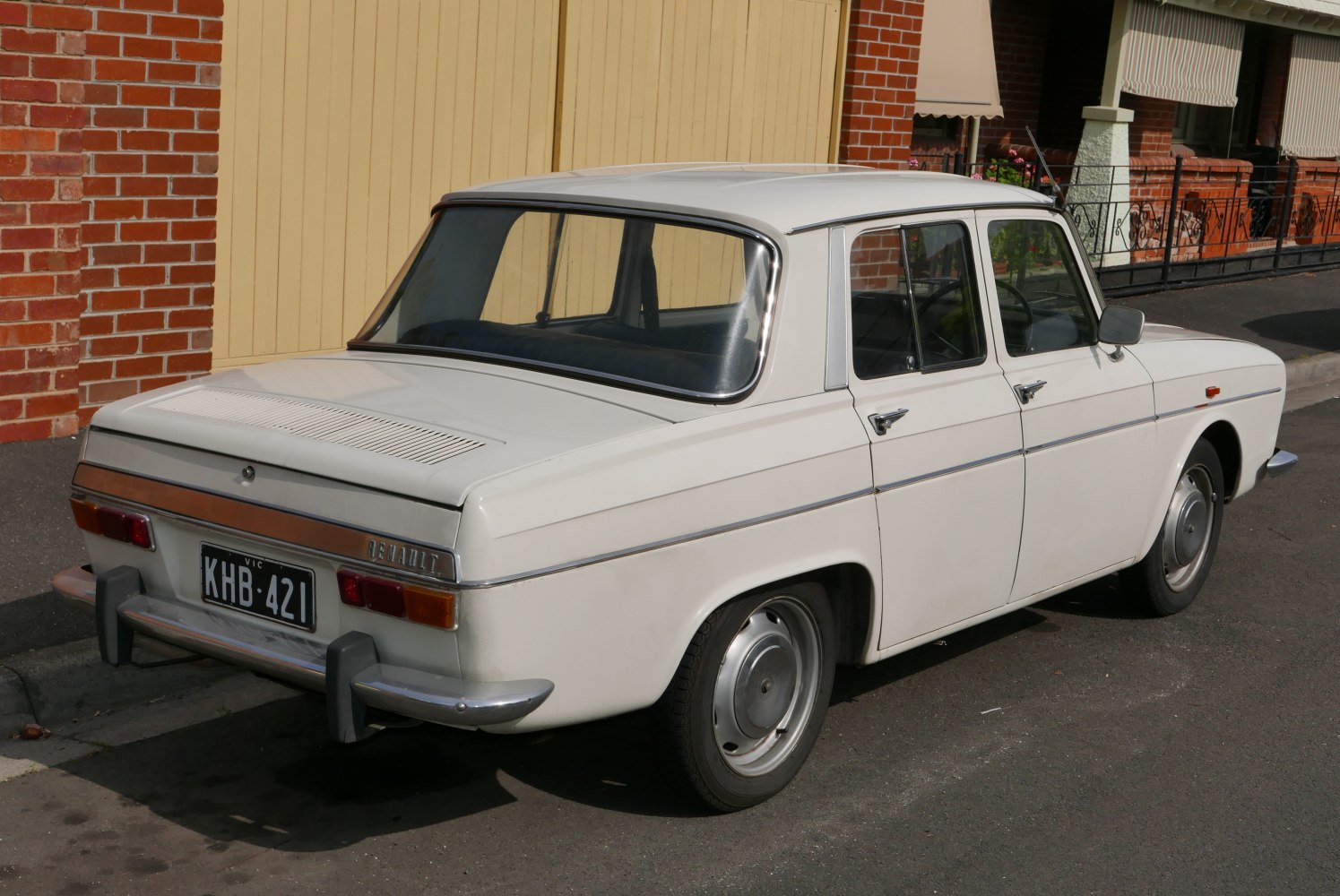 Rear sedan view with chrome bumper and angular body