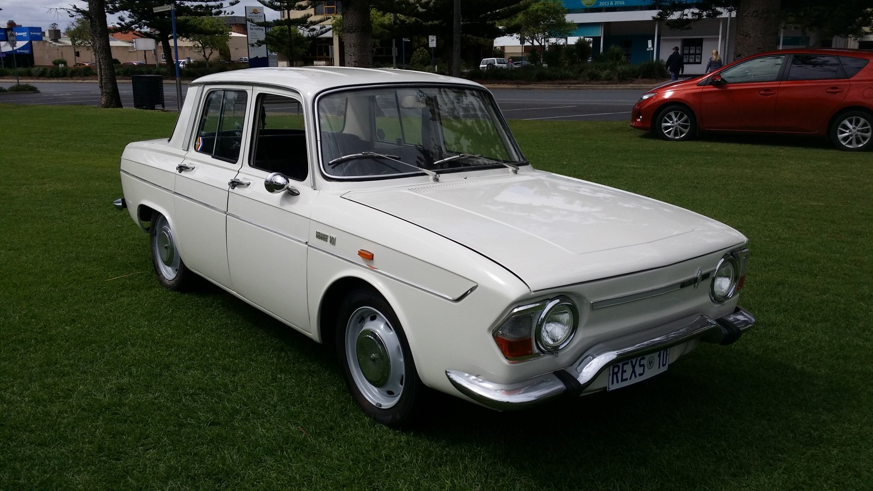 Vintage sedan with distinctive front headlights and classic 1960s design