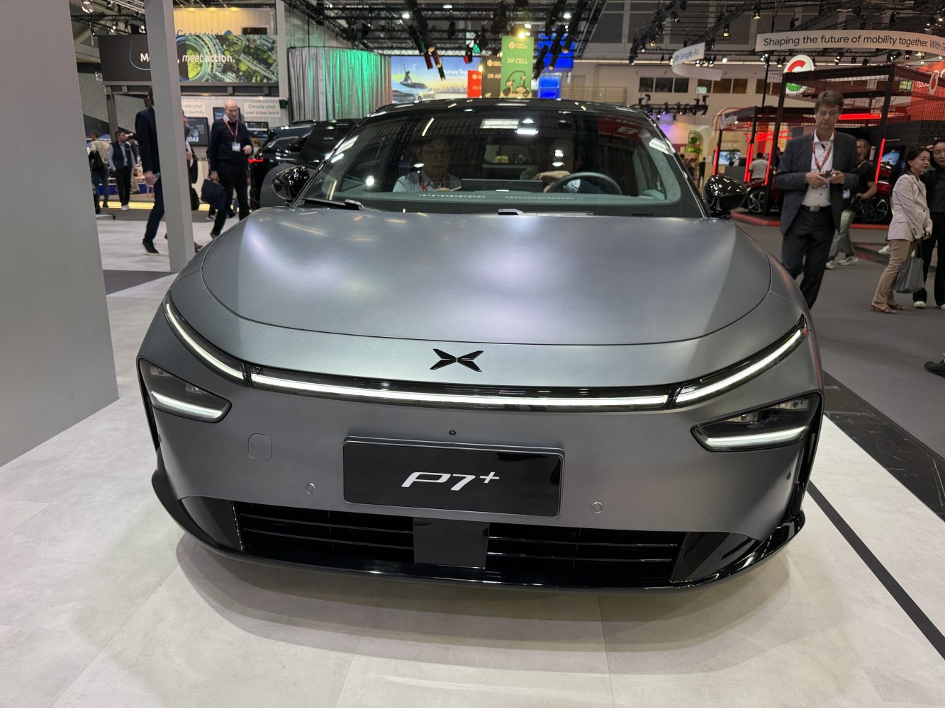 Sleek electric sedan front with distinctive LED lighting