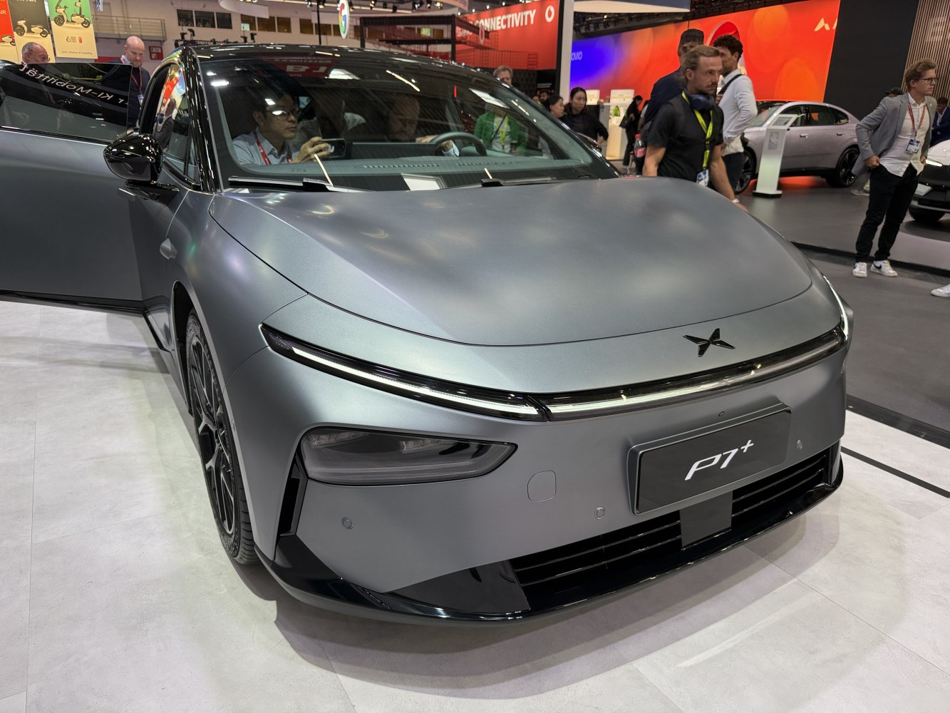 Sleek front view of electric sedan with LED headlights and aerodynamic lines