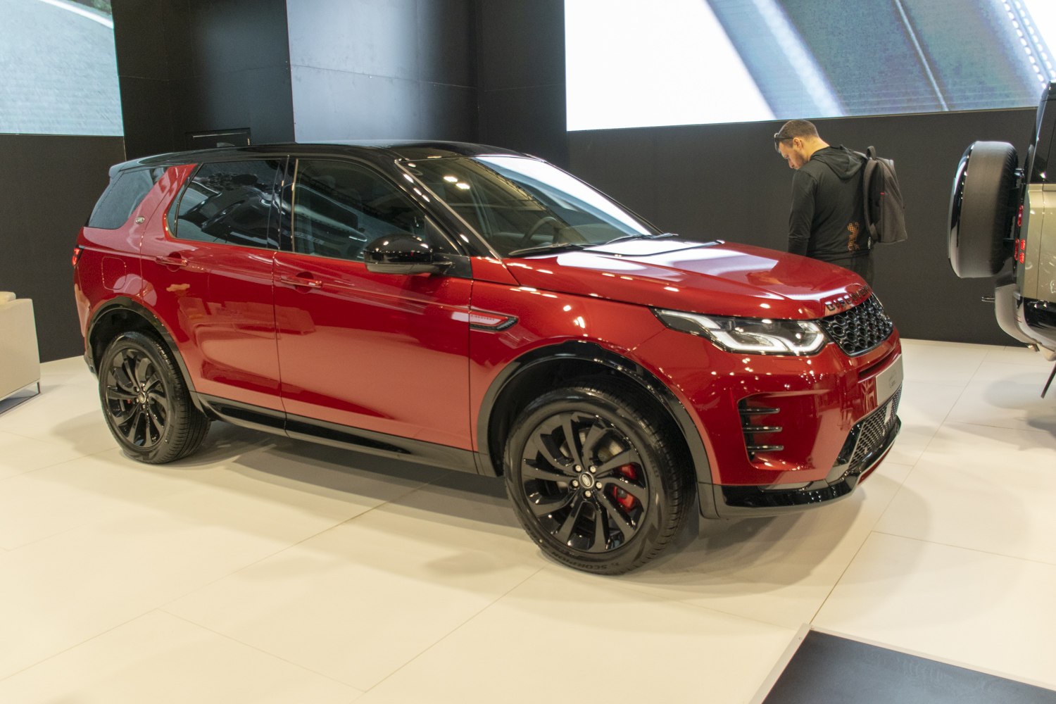 Red SUV with black alloy wheels and LED headlights