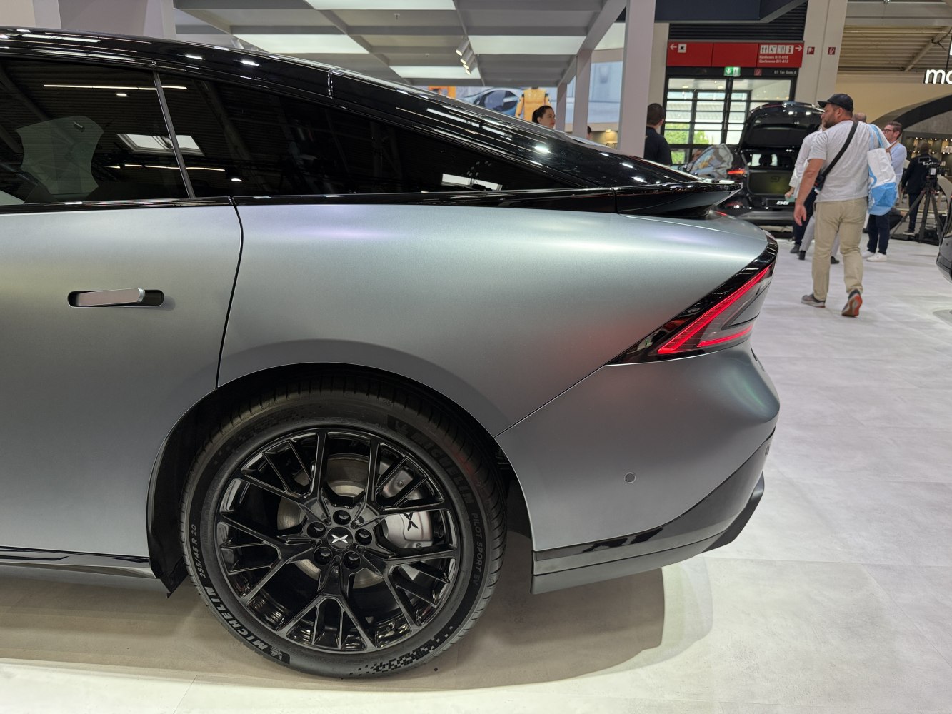 Rear wheel with Michelin tire and sharp LED rear light design.