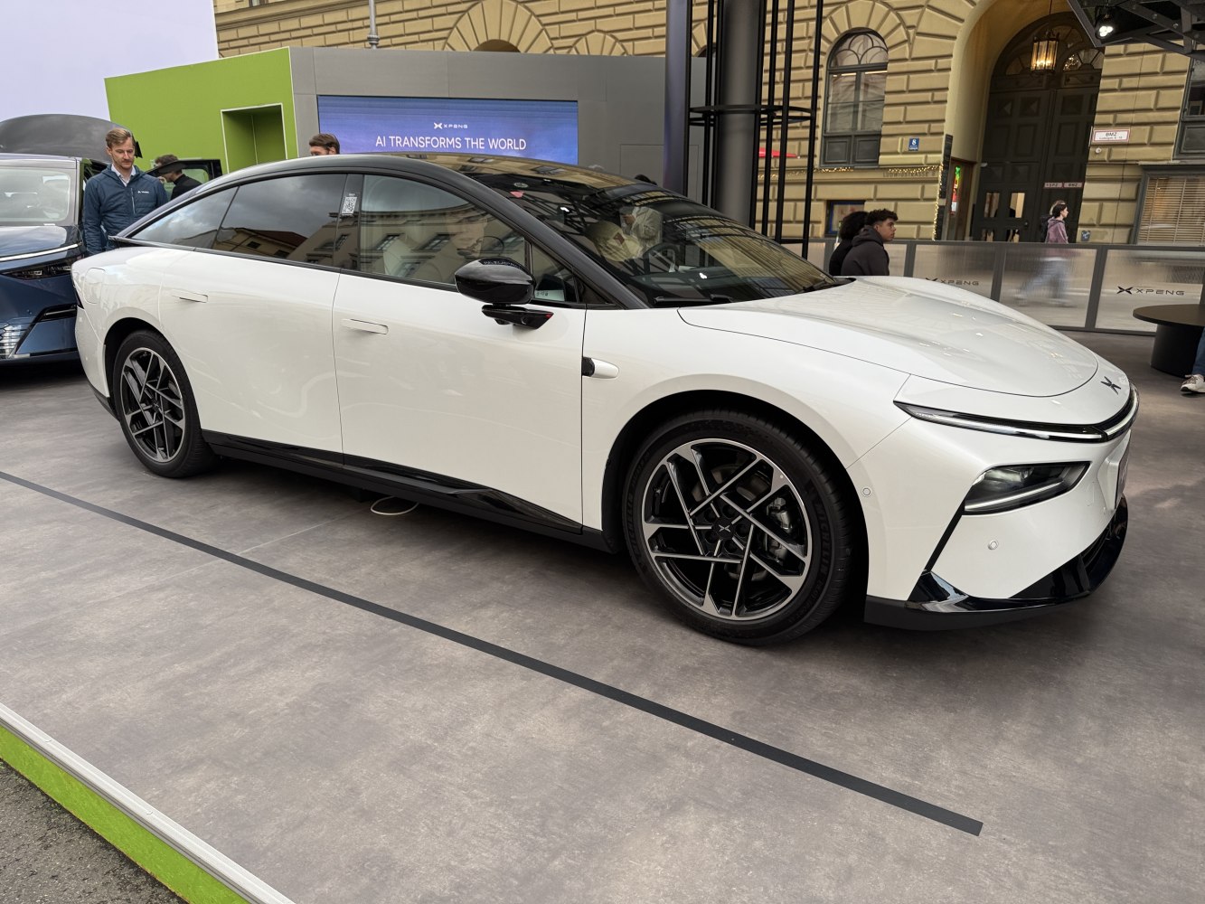 Sleek electric sedan with aerodynamic design and alloy wheels