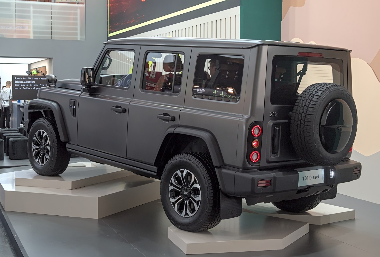 Rugged SUV with rear-mounted spare tire and multi-spoke alloy wheels