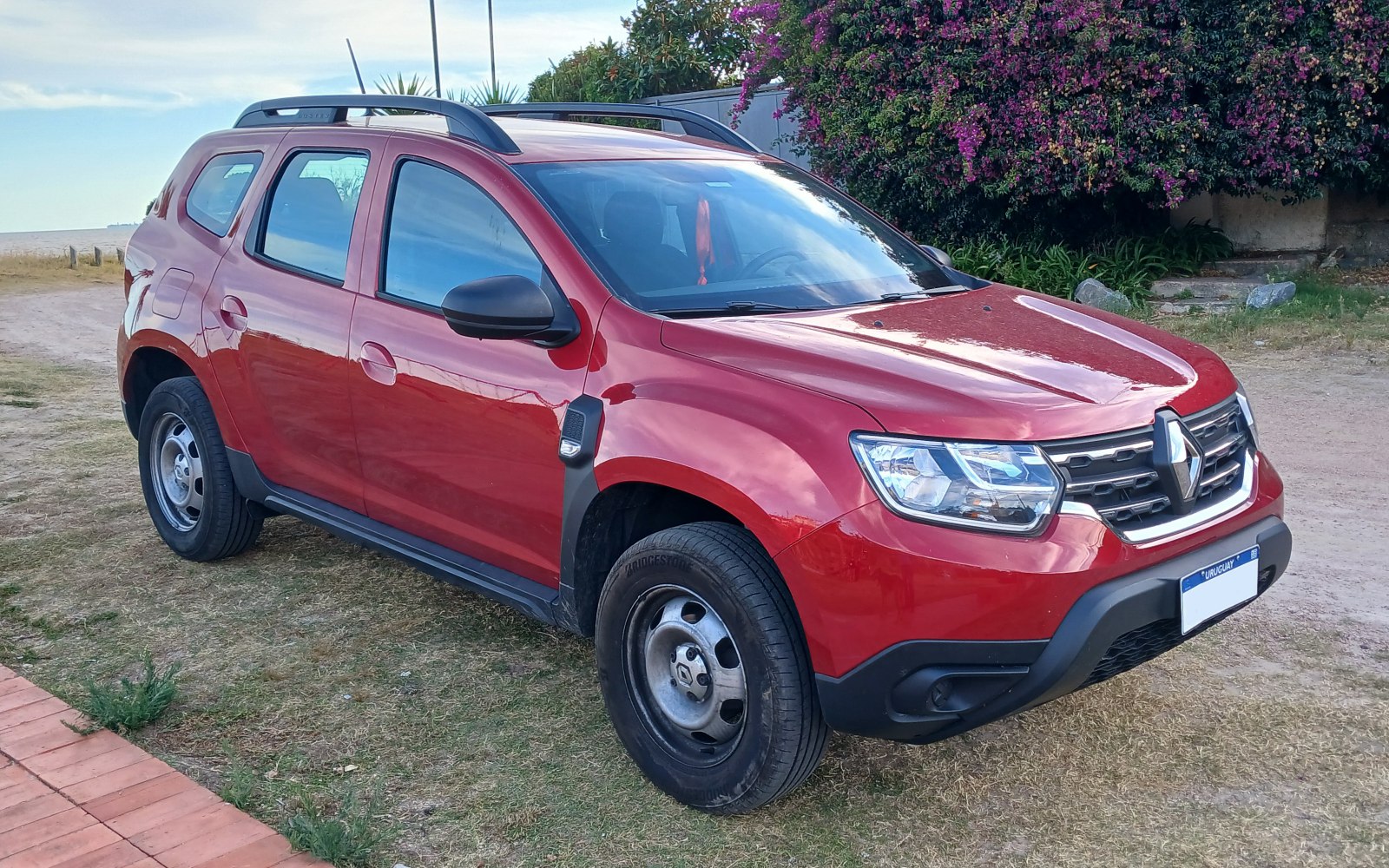 Red SUV front and side view with roof rails