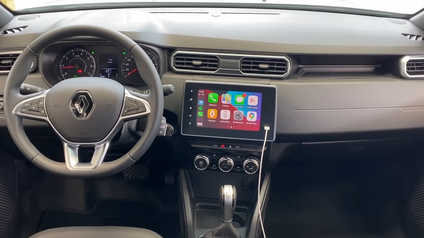 Modern car interior with touchscreen infotainment and multifunction steering wheel