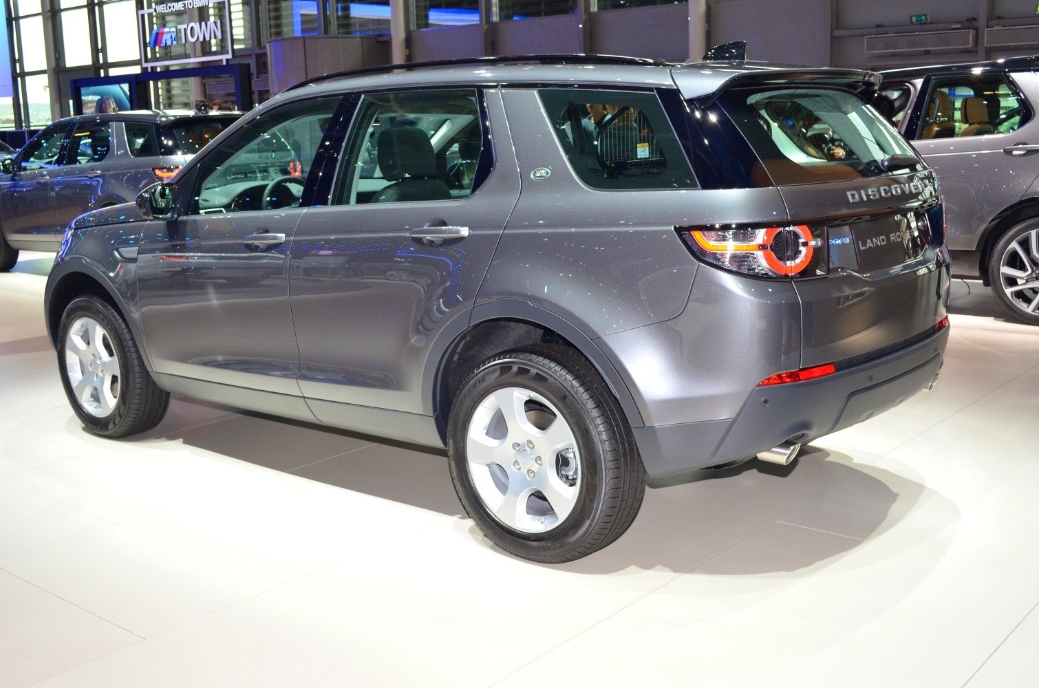 Rear side profile with modern tail light and polished surface