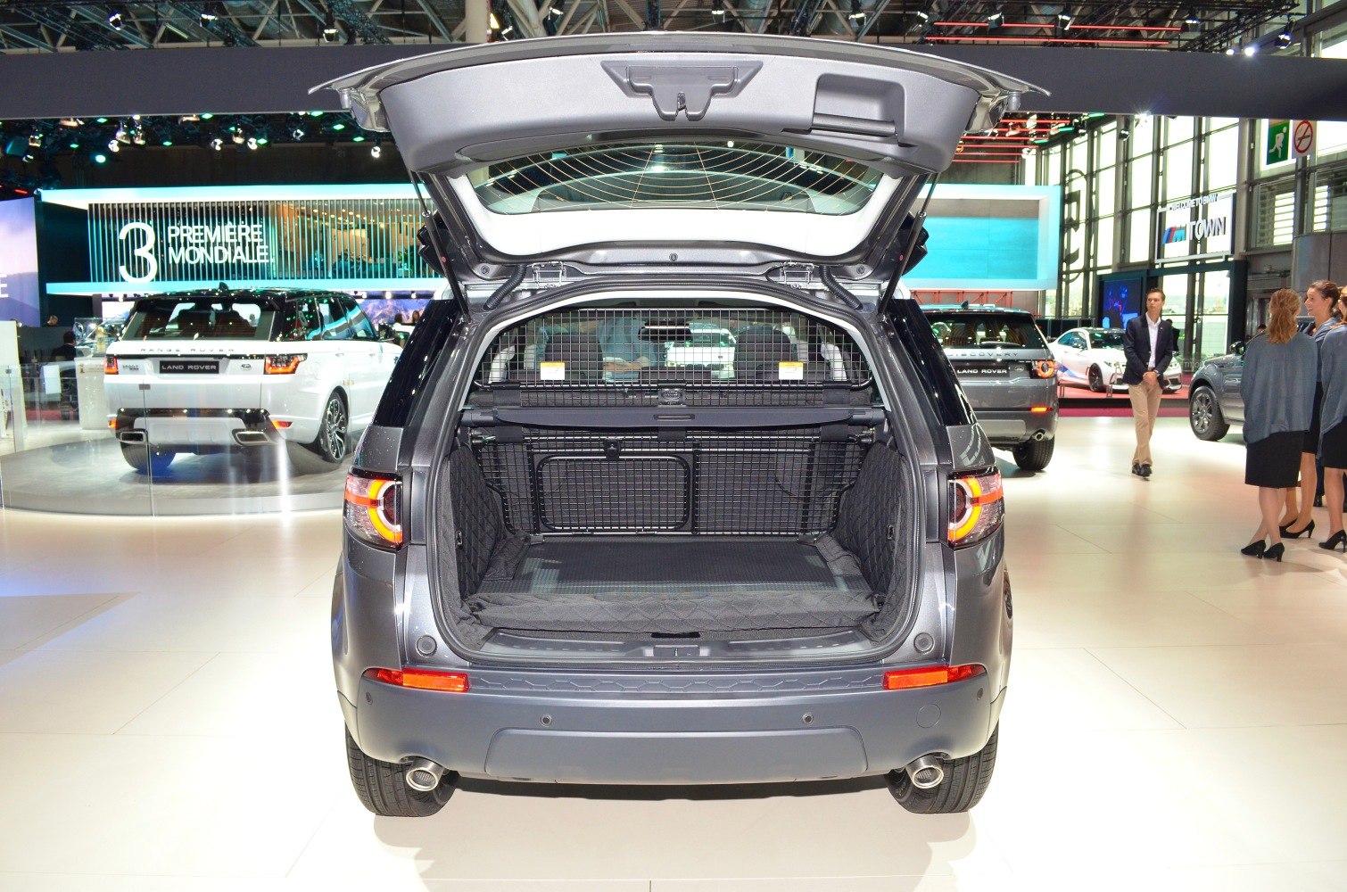 Large open trunk with protective net in SUV rear view