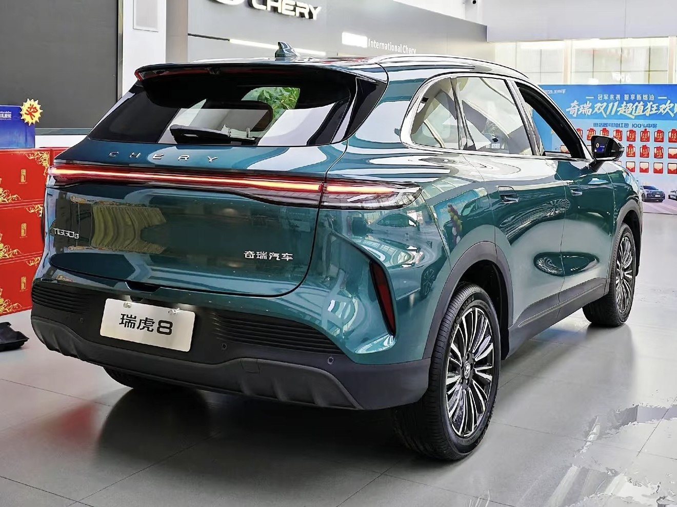 SUV rear with continuous LED tail light and multi-spoke alloy wheels