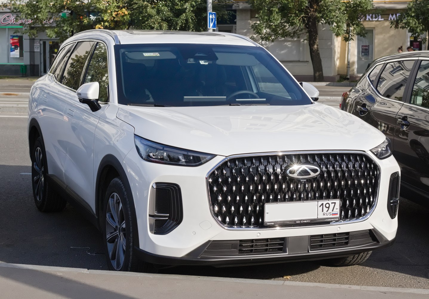 Bold front grille and sleek LED headlights on a modern SUV.