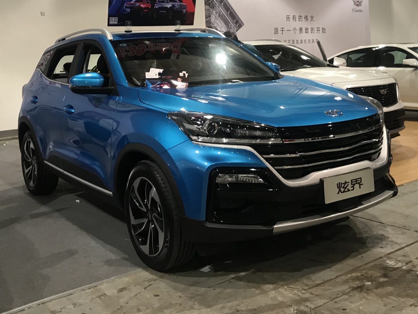 Blue SUV with LED headlights and bold front grille
