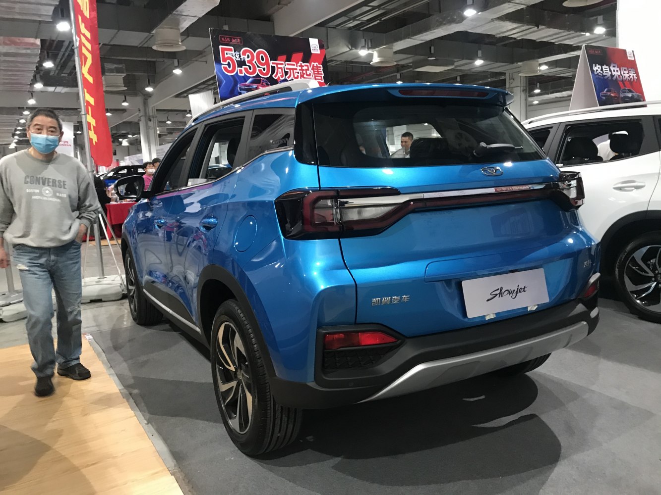 Rear view of blue SUV featuring modern taillights and sporty design