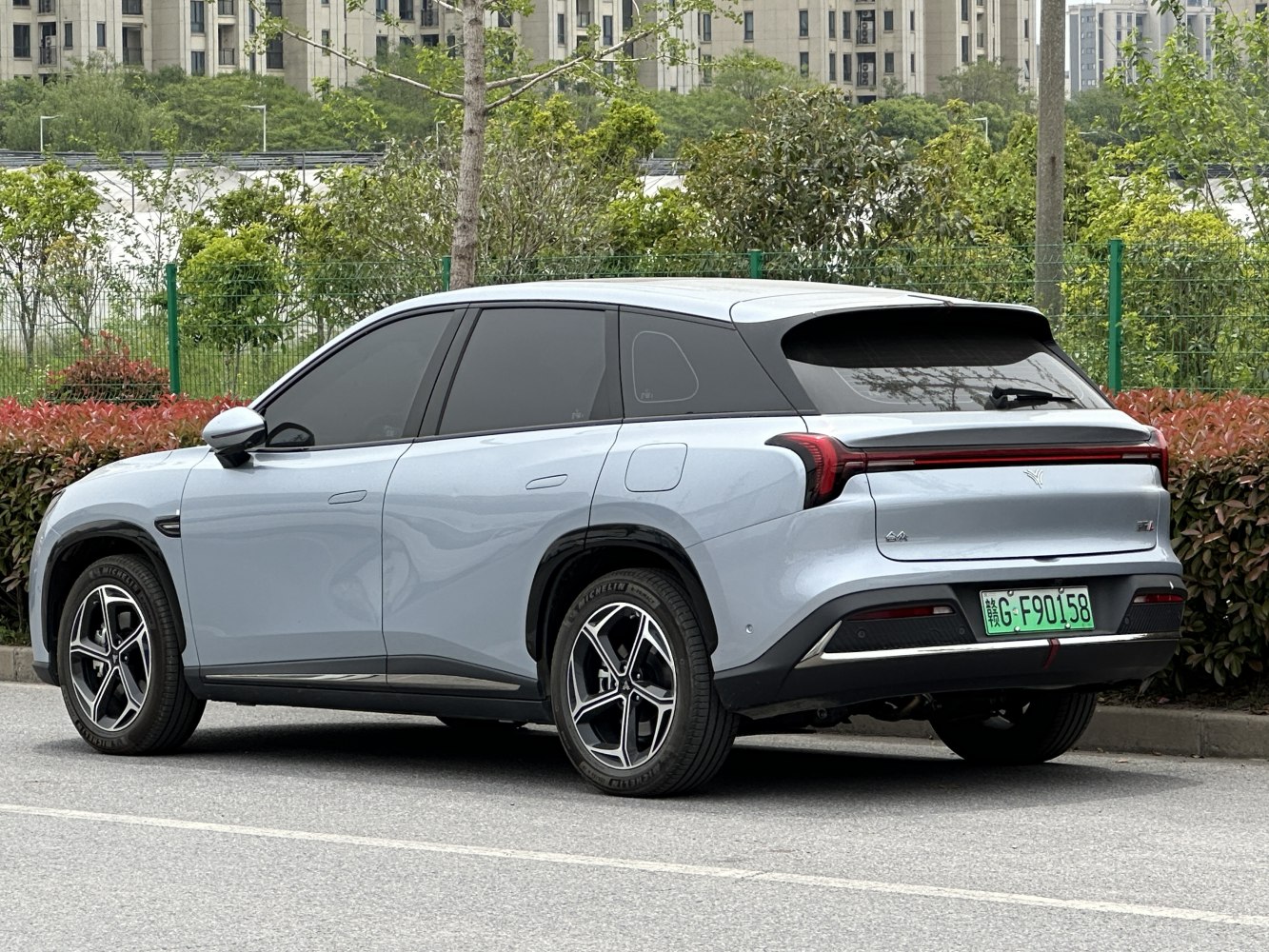 Rear view of electric SUV with modern taillights and alloy wheels