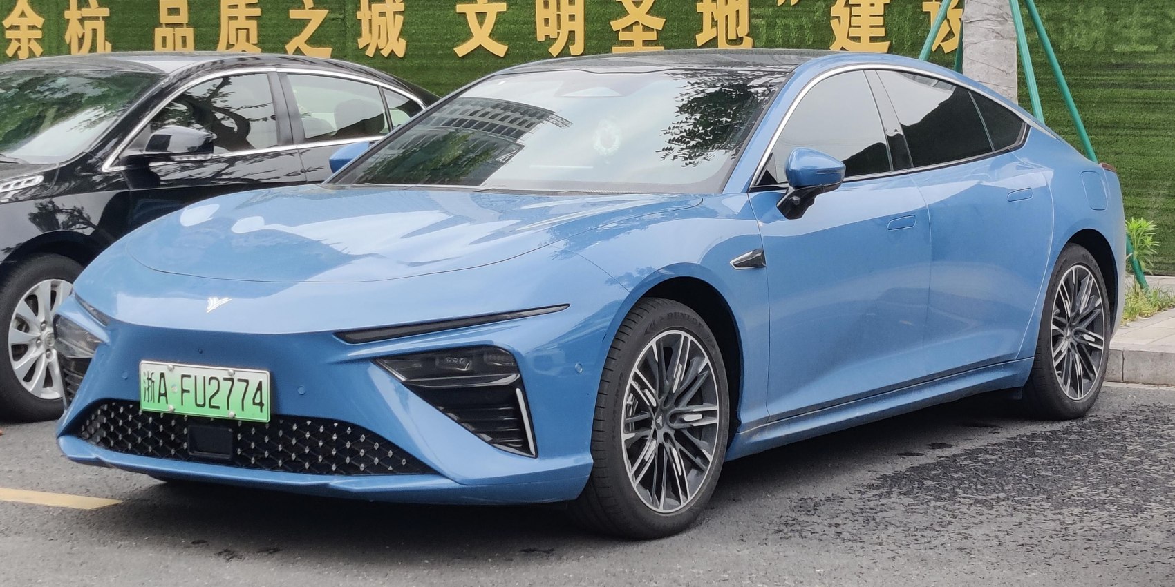 Electric sedan with slim headlights and aerodynamic body design
