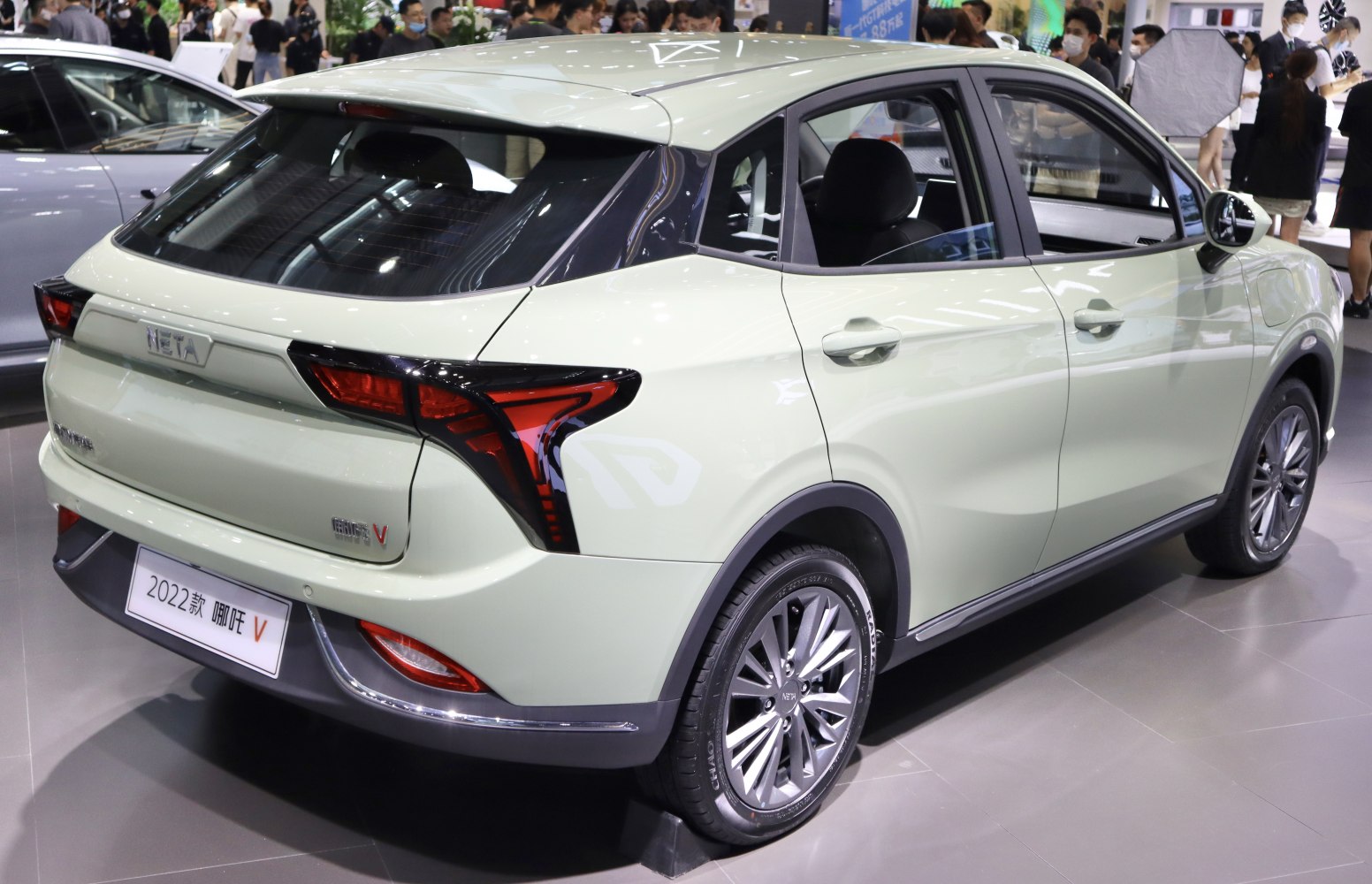 Rear-side view with distinct taillights and alloy wheels