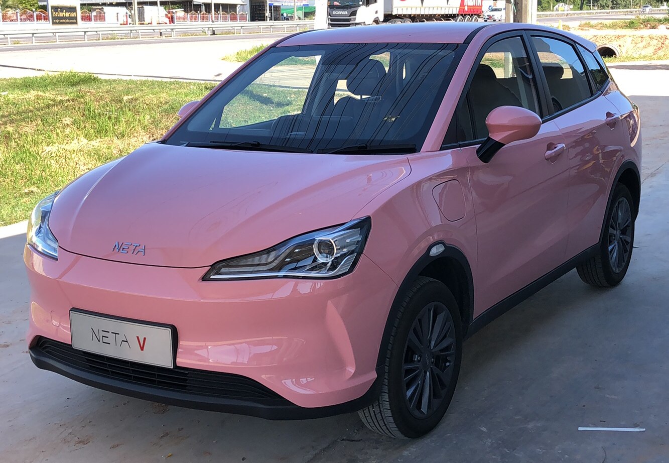 Pink compact electric SUV with LED headlights and modern design