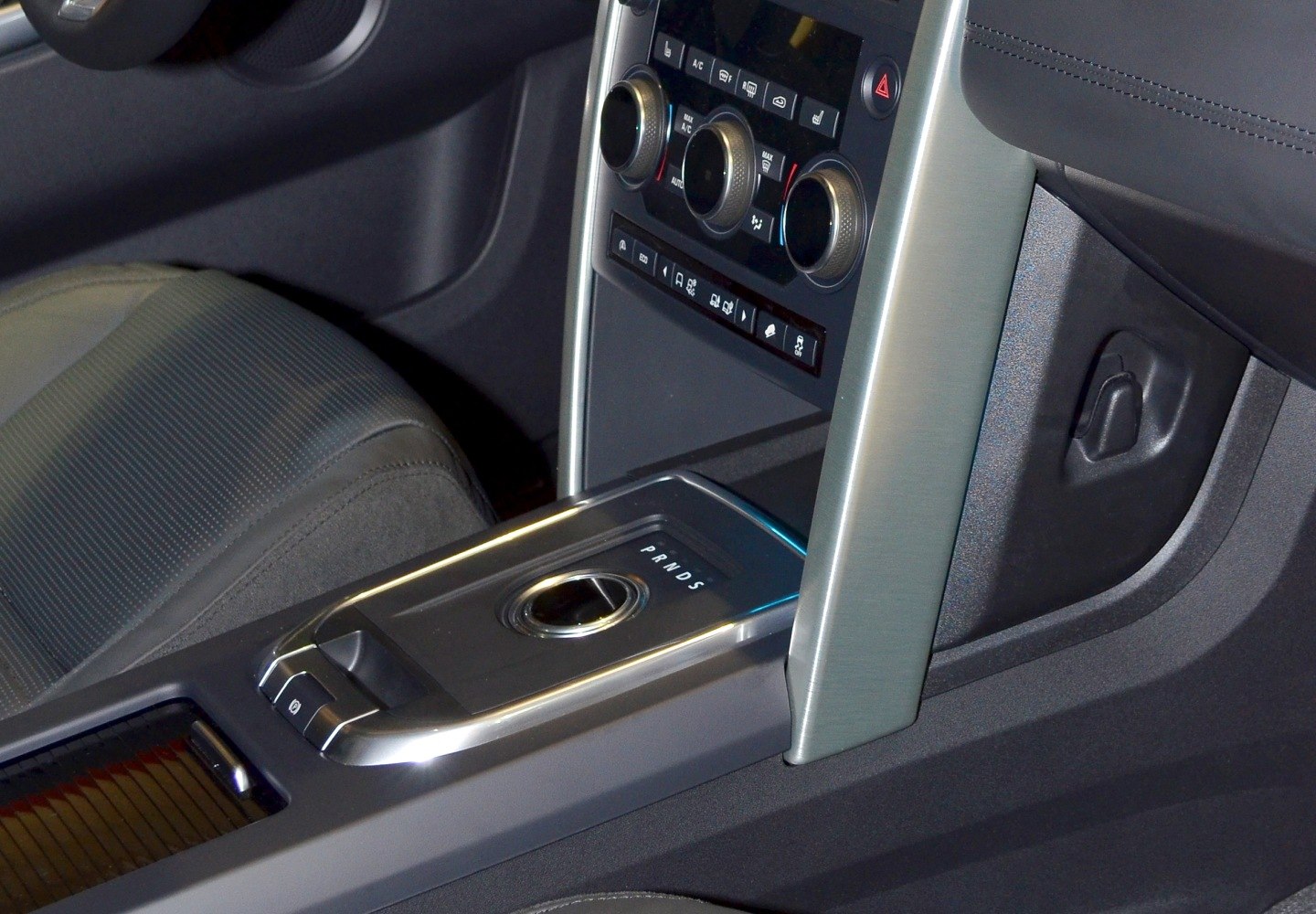 Rotary gear selector and climate control knobs on center console