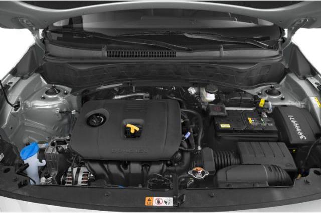 Modern engine bay with organized component layout and engine cover