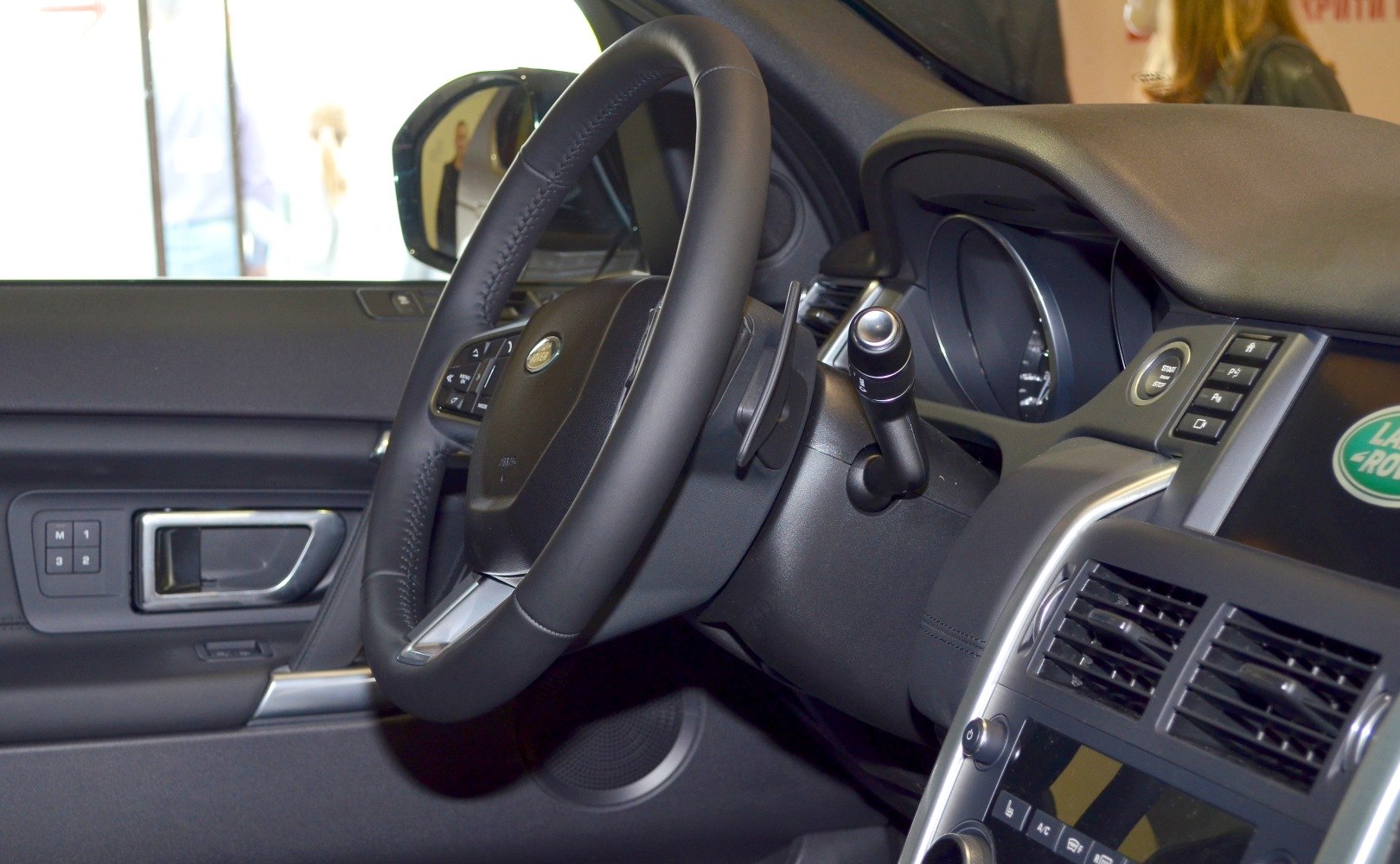 Steering wheel, dashboard, and control buttons of a vehicle interior