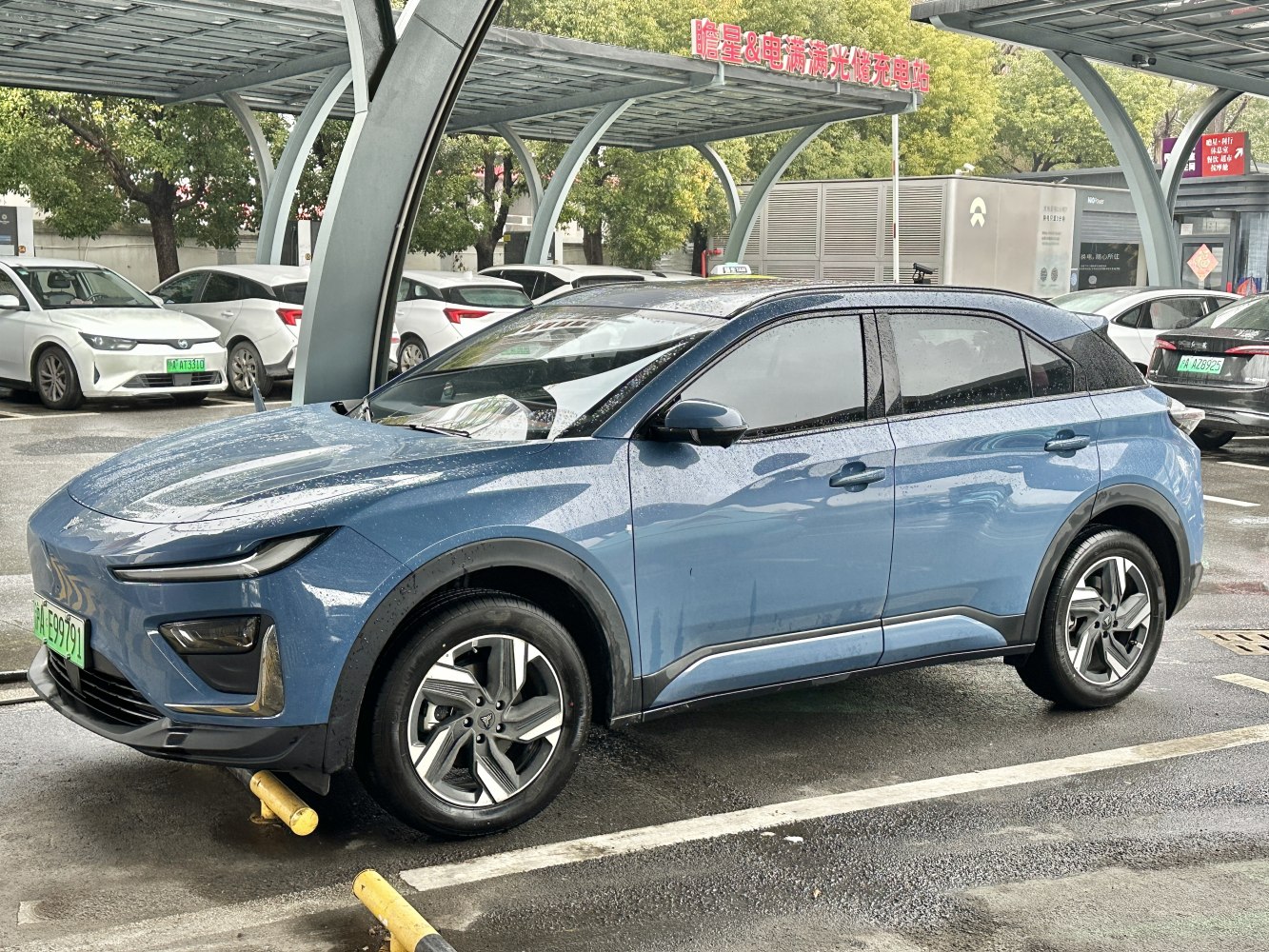 Blue electric SUV with sleek design and LED front lights