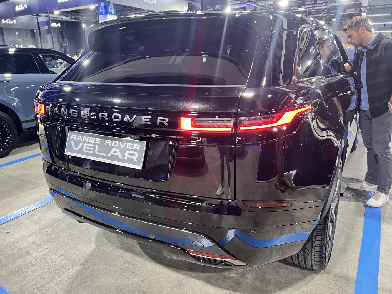 Sleek black SUV rear with modern LED taillights and illuminated badge