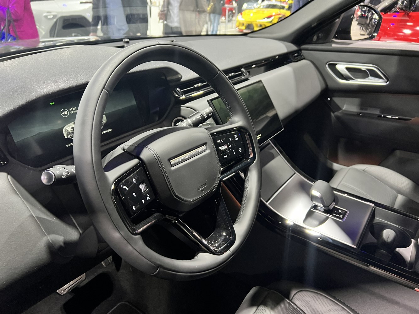 Luxury SUV interior with modern steering wheel and touchscreen center console