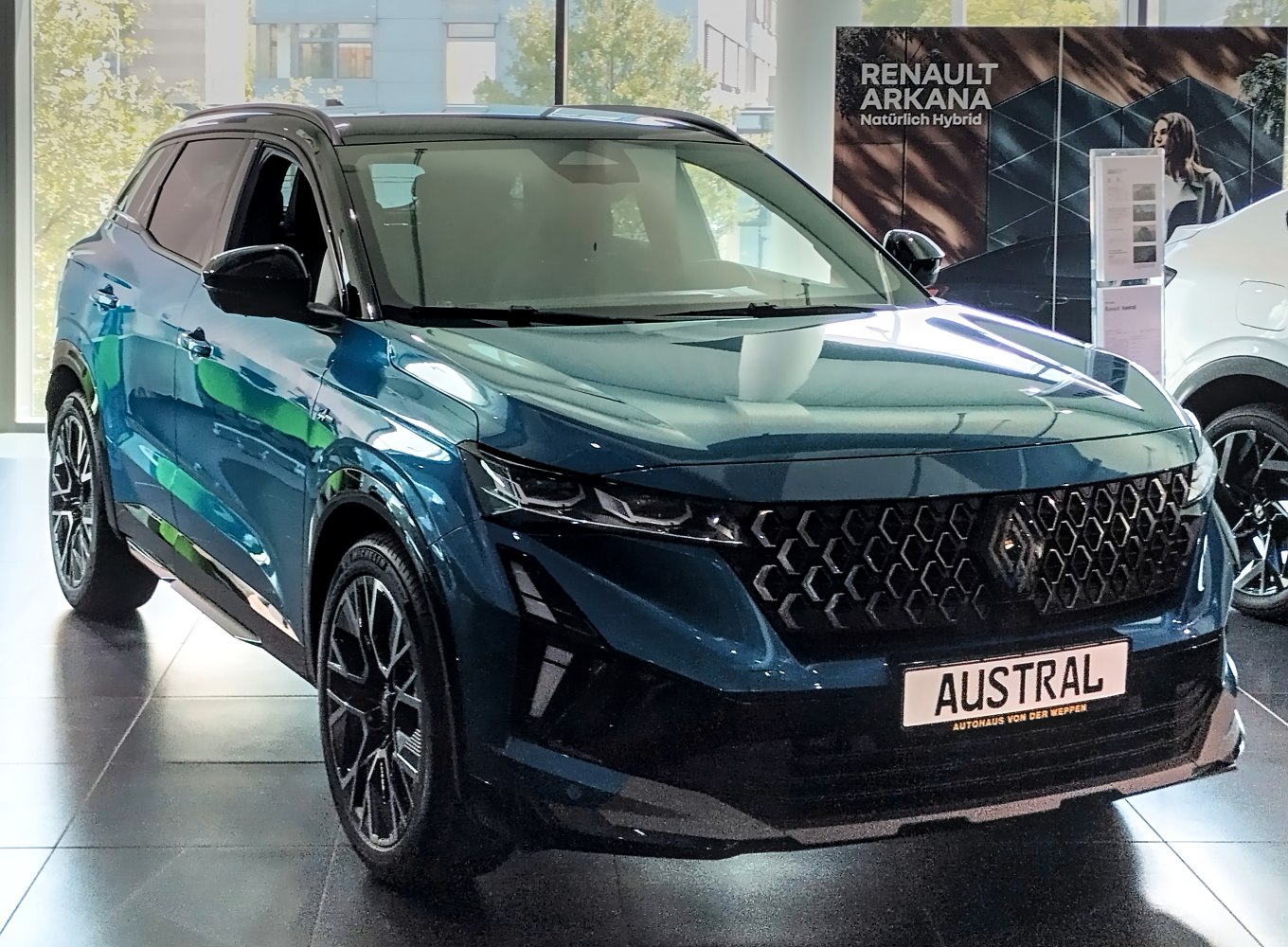 Front view of SUV with hexagonal grille and LED headlights