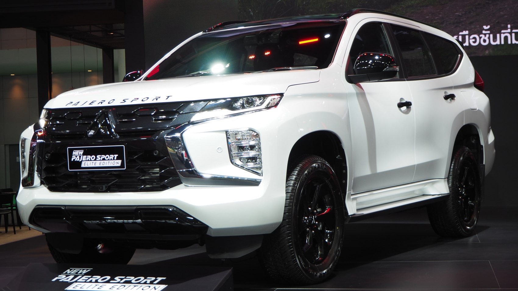 Front and side view of SUV with modern grille and sleek headlights.