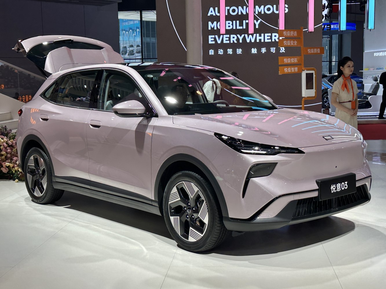 Front and side view of sleek modern SUV with open hatch