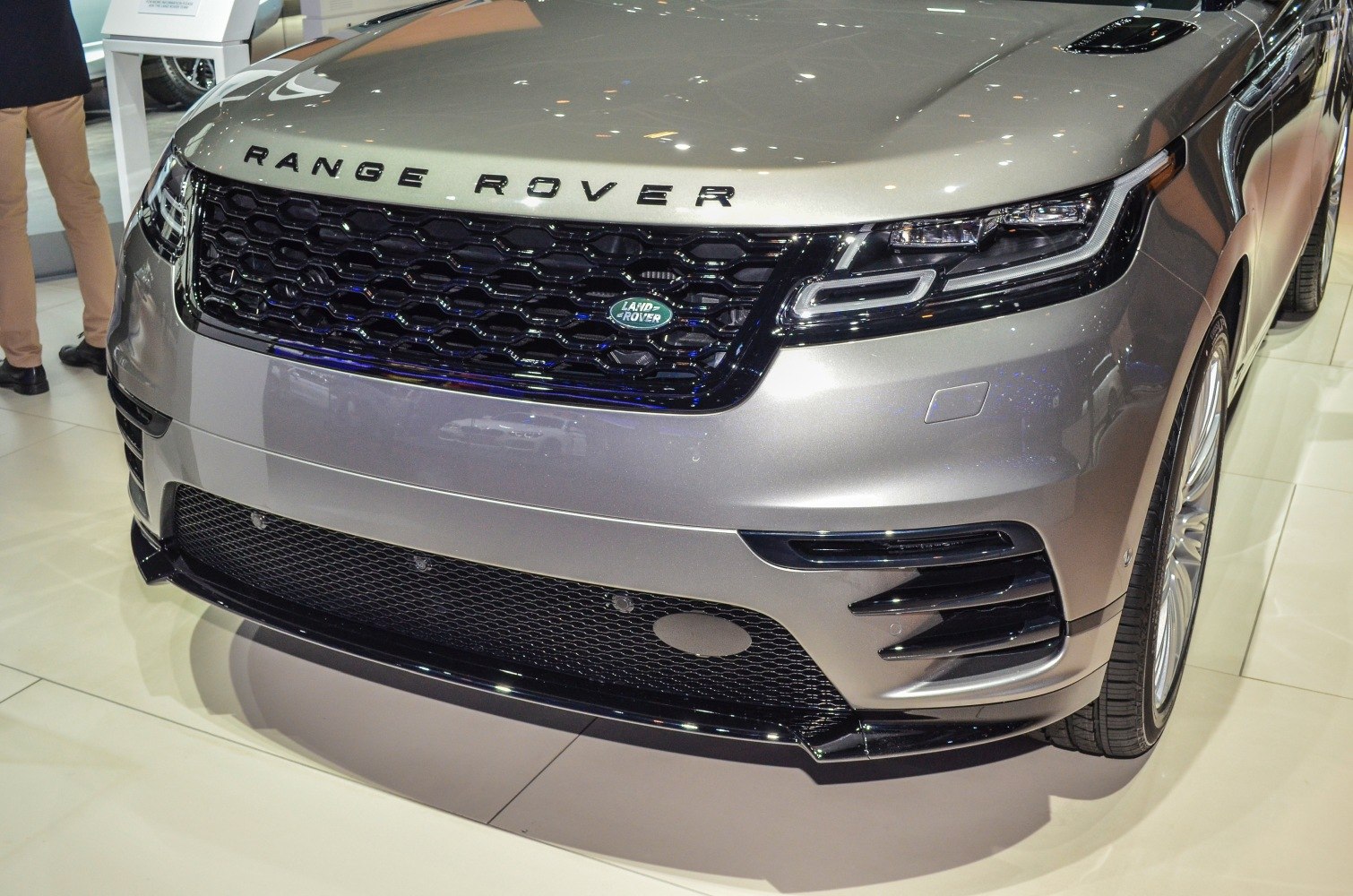 Close-up of an SUV front grille with LED headlights and sleek bumper design