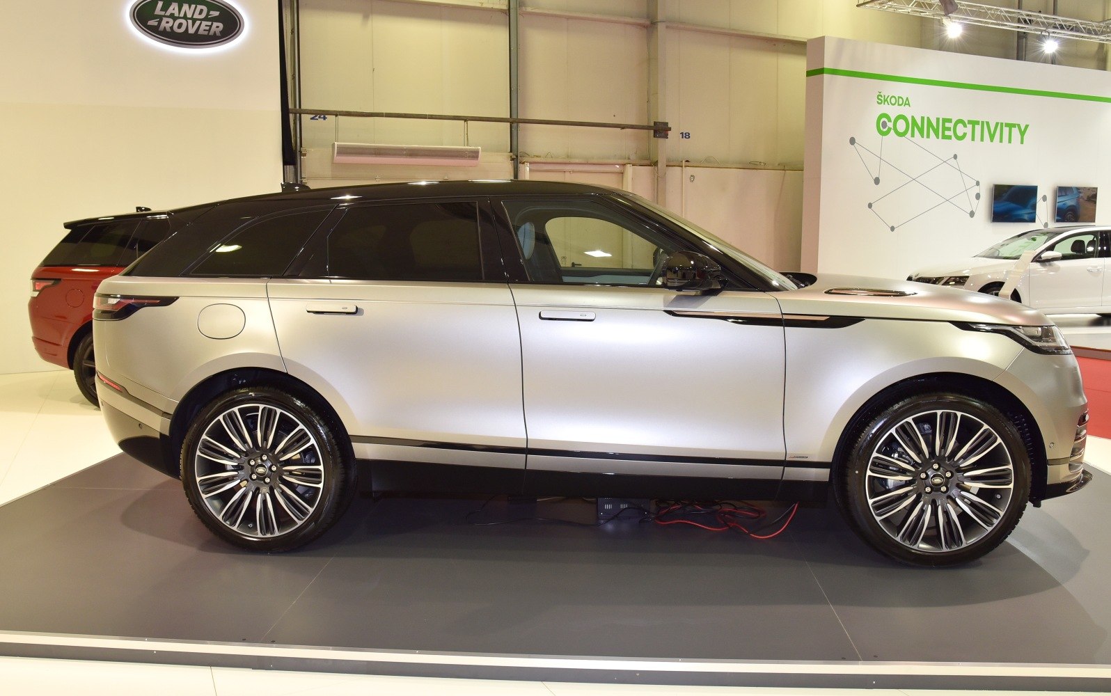 Sleek side profile of a SUV with alloy wheels and black roof