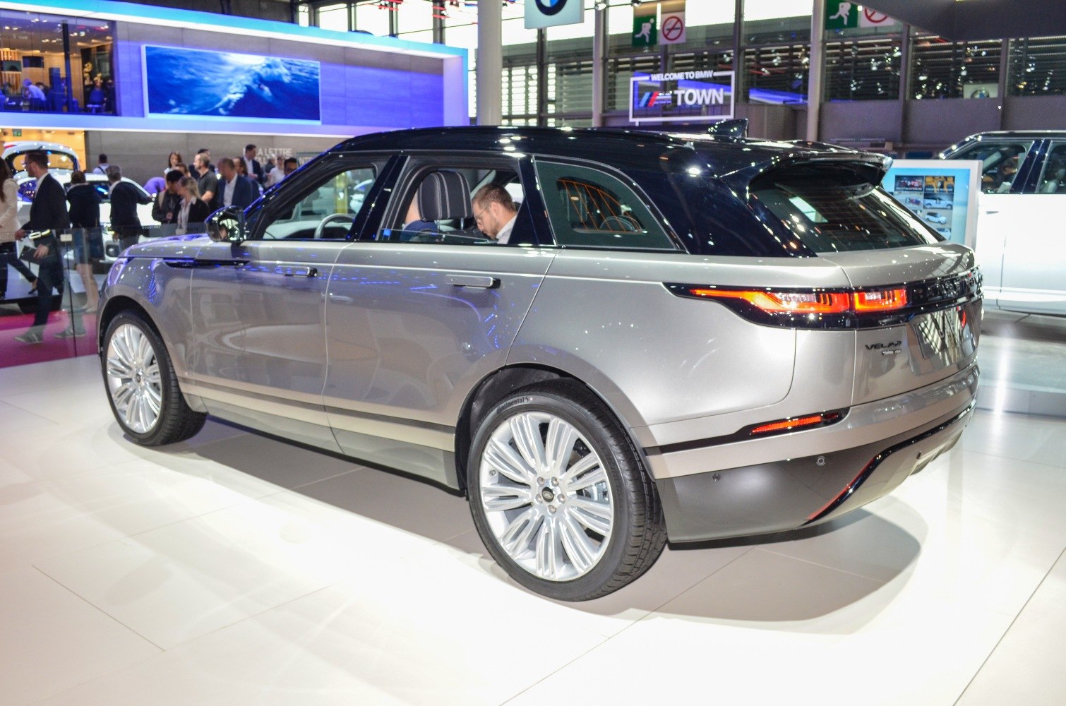 Rear and side profile of silver SUV with modern tail lights and alloy wheels