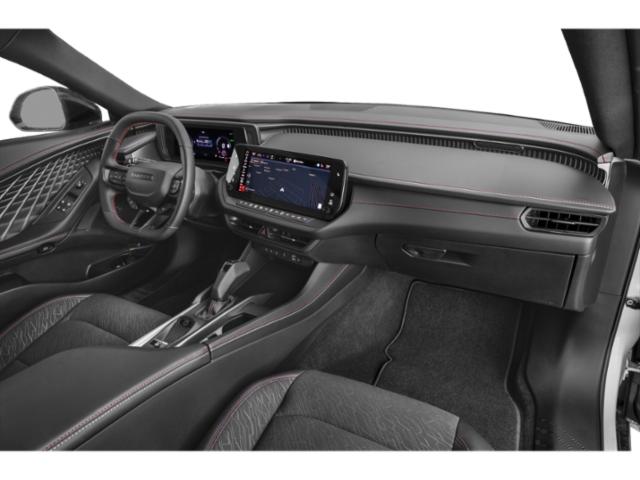 Modern car cabin with digital instrument cluster and touchscreen infotainment system.