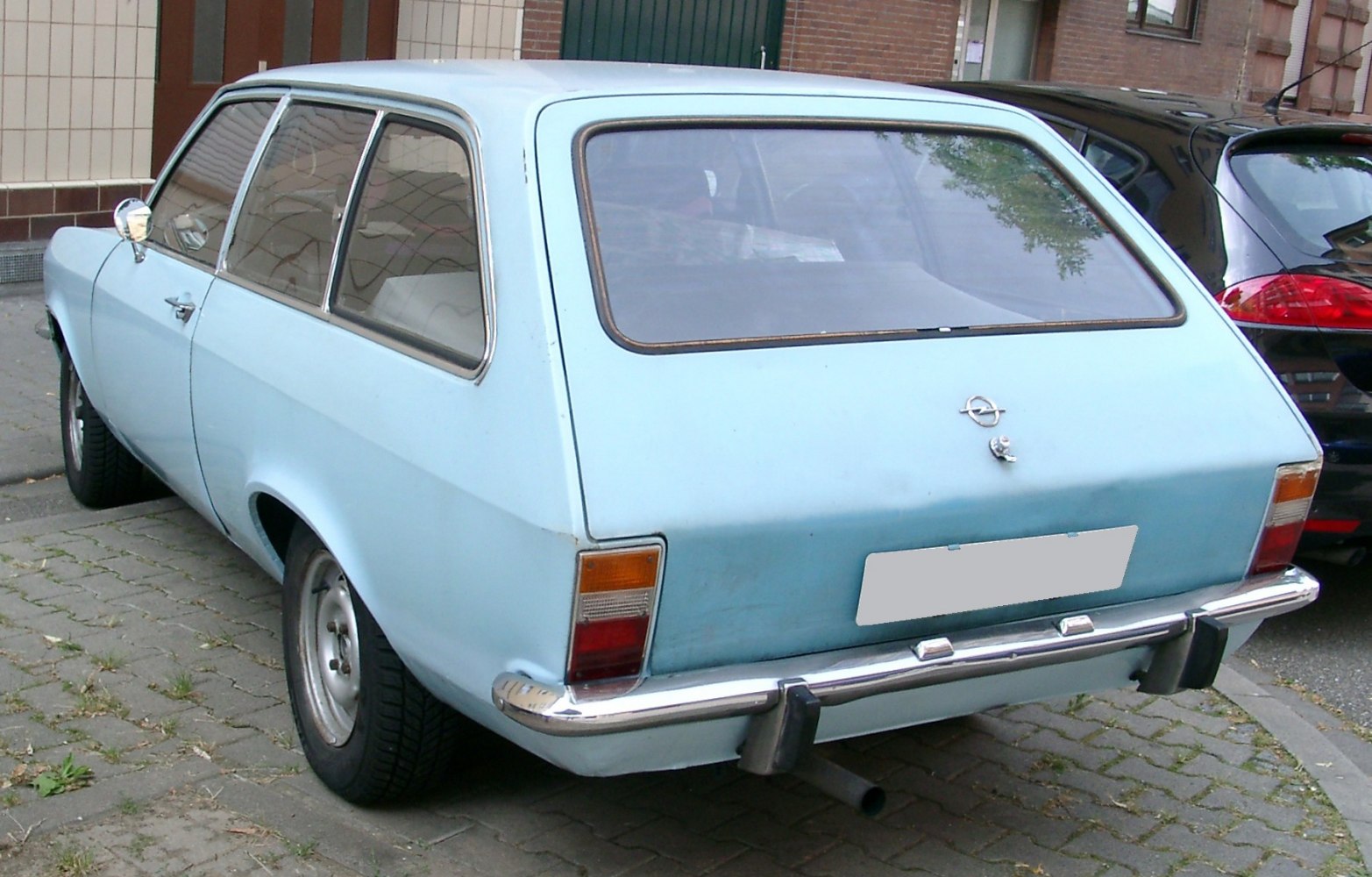 Rear view of 1970s vintage station wagon with chrome bumper.