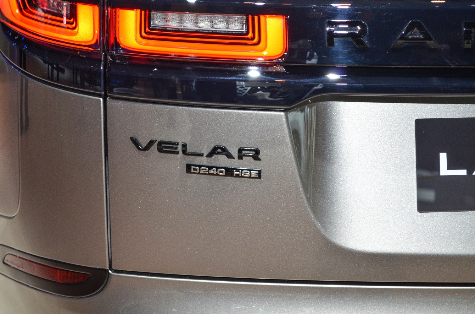 Close-up of Velar badge and rear taillight detail